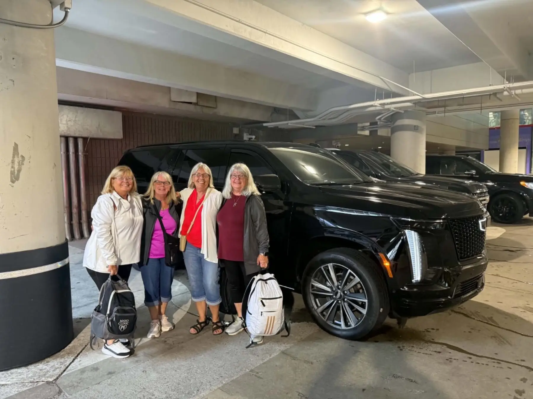 Travelers with First Class Limo Escalade